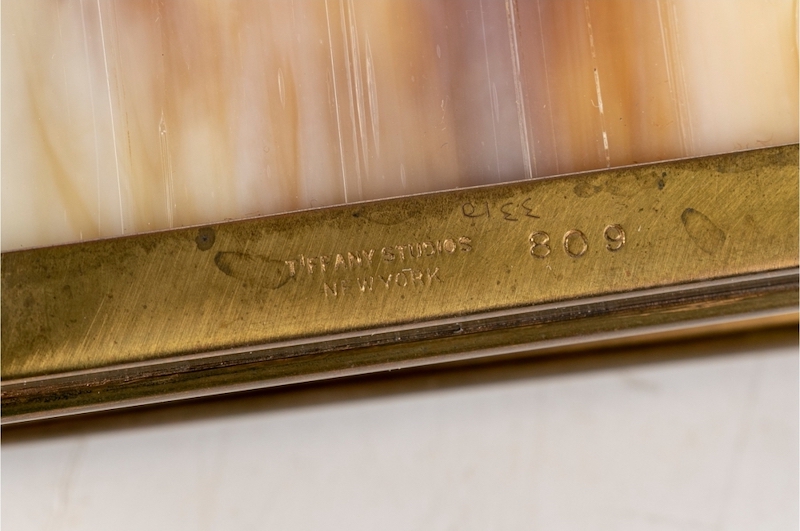 Tiffany Studios mark on gilt metal with amber slag glass